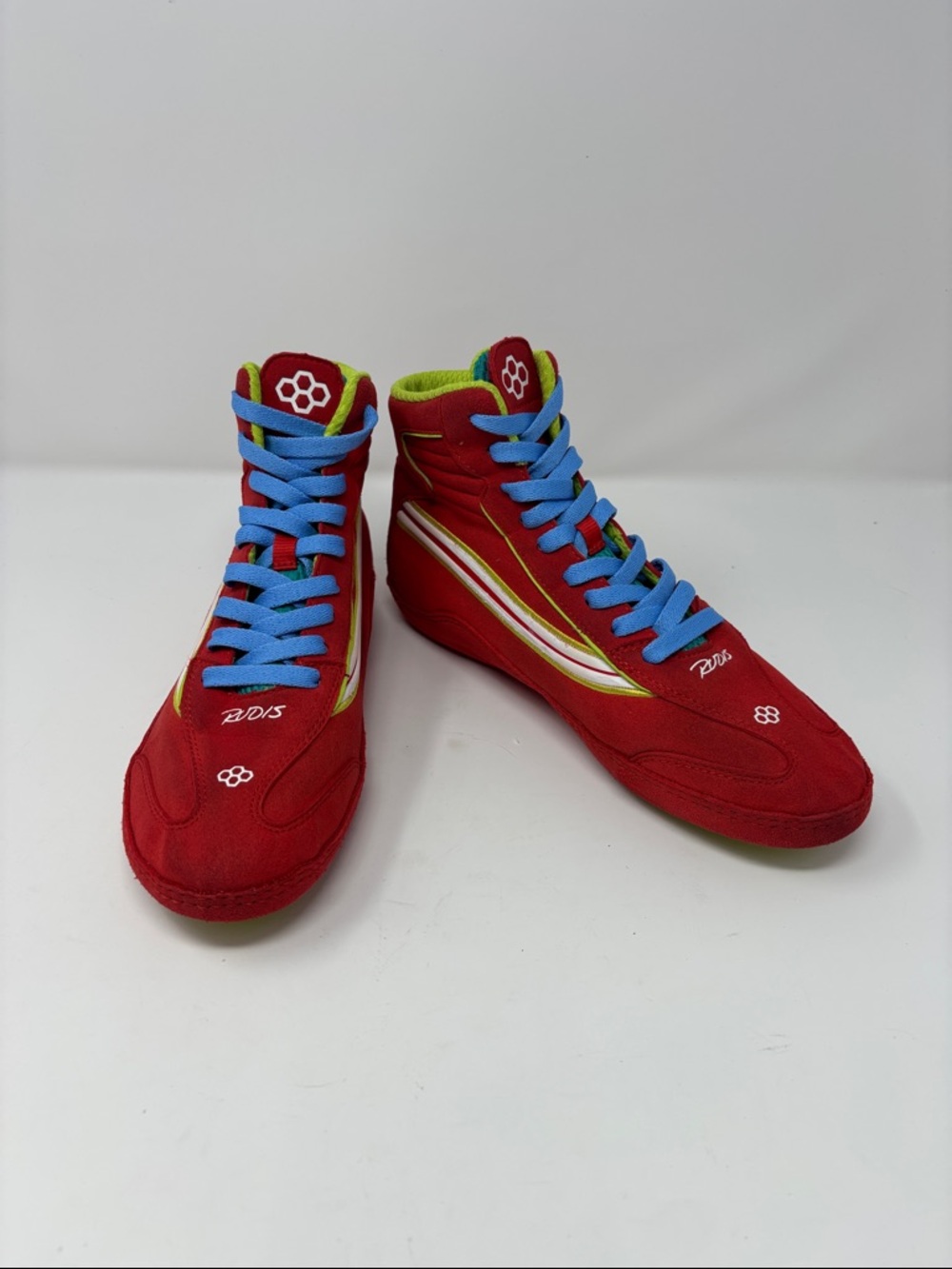 Rudis | 95s Red High-Top Sneakers wrestling with Blue Laces and Lime Accents 8